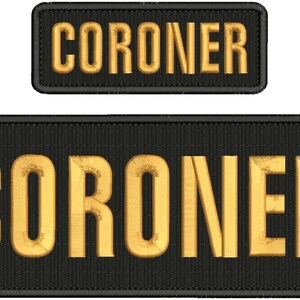 May include: Two black embroidered patches with the word "CORONER" in gold lettering. The top patch is smaller than the bottom patch.