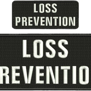 May include: Two black embroidered patches with white text. The top patch reads "LOSS PREVENTION". The bottom patch reads "LOSS PREVENTION".