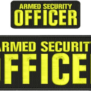 May include: Two black patches with yellow embroidered text. The top patch reads "ARMED SECURITY OFFICER". The bottom patch is larger and reads "ARMED SECURITY OFFICER".