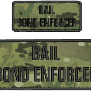 May include: Two black and green camouflage patches with black text that reads "BAIL BOND ENFORCER".