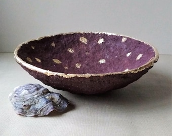 Unique purple recycled paper bowl with a gold rim and spots. Decorative paper mache plate for a sophisticated interior.