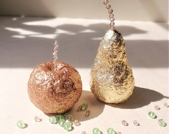 Decorative paper mache apples and pears with crystal stalks. Christmas decorations. Gold, green, red and glittering pear and apple.