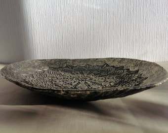 Large paper mache plate with ethnic style relief with an old gold effect. Recycled paper artwork.