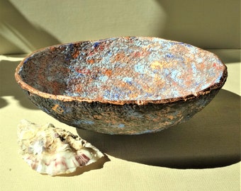 Decorative paper mache bowl with bronze rim. A little sea blue, sunset blush... for a sophisticated interior. Recycled paper artwork.