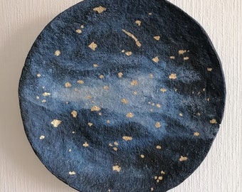 Large navy blue paper mache wall plate with gold spots. Contemporary art papier pulp bowl to hang on the wall. Recycled paper wall decor.