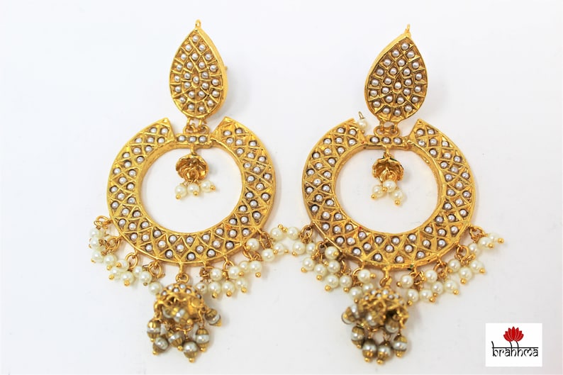 White beads embedded in Golden base Indian jewelry