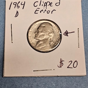 May include: A set of three ceramic mugs with a speckled, matte finish. The mugs are in shades of cream, light gray, and dark gray. Each mug has a simple, minimalist design, perfect for coffee or tea.