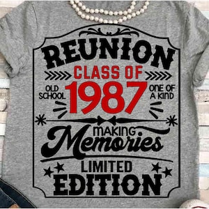 May include: Gray t-shirt with a black and red graphic design. The design includes the words "REUNION CLASS OF 1987" and "MAKING MEMORIES LIMITED EDITION". A pearl necklace is draped across the top.