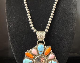 L. Begay and T. Nez Sr., Navajo, Golden Hills Turquoise Pink Conch Orange Spiney and Coin Pendant Cluster Necklace in Sterling Silver