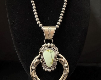 Ella Peters, Navajo, Palomino Variscite Naja Pendant in Sterling Silver with Brushed Finish