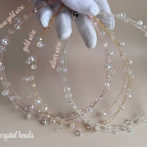 May include: Three crystal bead headbands in rose gold, gold, and silver wire.  The headbands are made with clear crystal beads and are shown on a white surface.  Only crystal beads.