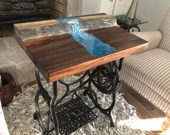 exquisite waterfall table made of exotic  Guanacoste  wood mounted on antique sewing machine