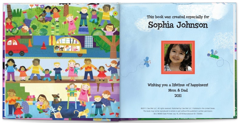 May include: A personalized children's book with a blue cover and a colorful illustration of people and vehicles. The book is titled "This book was created especially for Sophia Johnson" and includes a photo of a young girl. The text also reads "Wishing you a lifetime of happiness! Mom & Dad 2011."