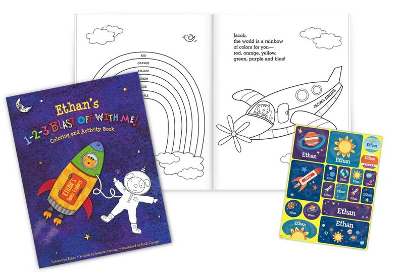 May include: A personalized coloring and activity book with a blue cover featuring a rocket ship and an astronaut. The title of the book is "Ethan's 1-2-3 Blast Off With Me!" and the book includes stickers with a space theme.