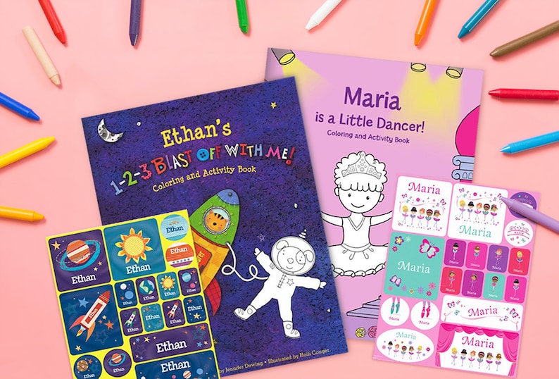 May include: Two personalized coloring and activity books with sticker sheets. The book on the left features a rocket ship and the text "Ethan's 1-2-3 Blast Off With Me!" The book on the right features a ballerina and the text "Maria is a Little Dancer!" Both books have colorful covers and are surrounded by crayons.