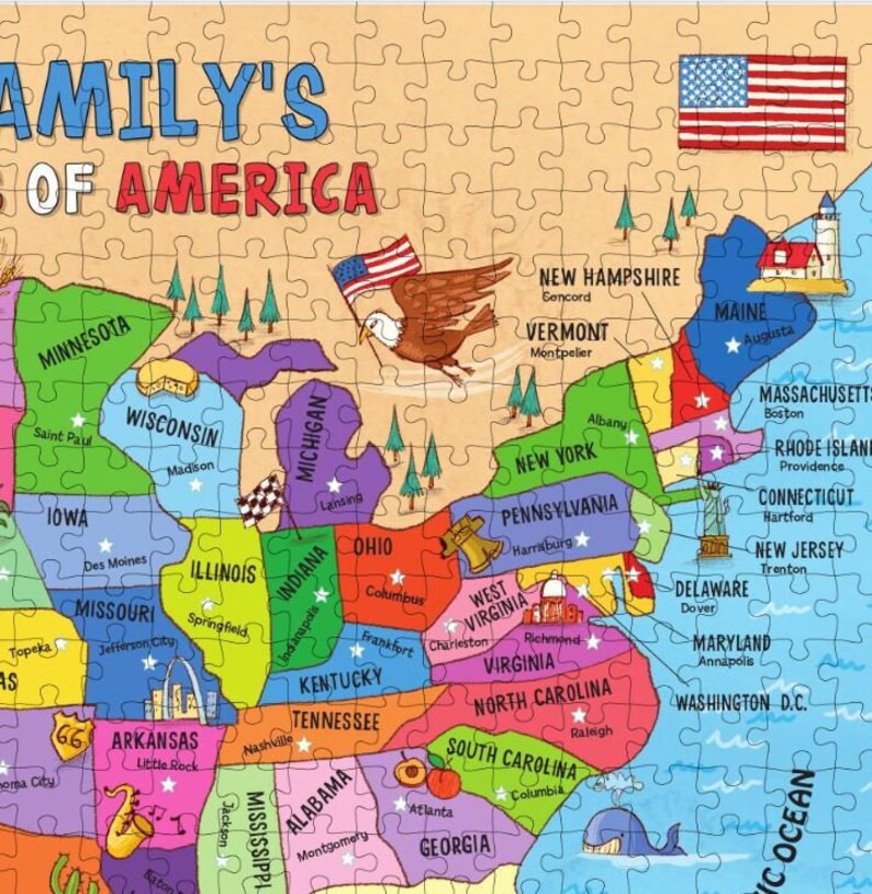 May include: A colorful map of the United States with each state outlined and labeled. The map features a cartoon eagle holding the American flag, and each state has a small star and a city name. The map is on a light brown background.