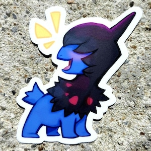 May include: A sticker featuring a blue creature with a black and purple head and neck, and red accents. The creature has a happy expression and is set against a white border. A yellow burst shape is above the creature's head.