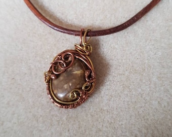 Copper and brass wire wrapped pendant with jasper stone and colour coordinated leather cord.