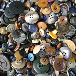 May include: A large collection of assorted buttons in various colors, shapes, and sizes. The buttons are made of different materials, including plastic, metal, and wood. Some buttons have intricate designs, while others are plain.