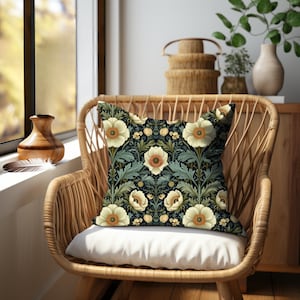 Square accent pillow with a repeating pattern of creamy white poppies with yellow orange centers surrounded by green leaves and foliage in a lovely Victorian style botanical print. William Morris Art Nouveau style. Printed on both sides.