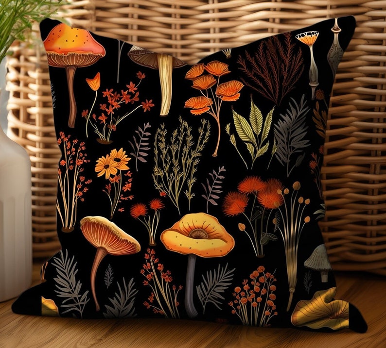 Pillow on a wooden bench. Pillow has orange and yellow mushrooms, and red, yellow and brown forest flowers all on a white background. Printed on both sides