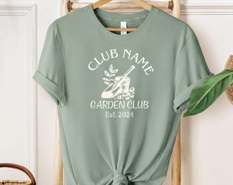 Camiseta personalizada para club de jardinería: diseño retro de pala y maceta. Regalo ideal para jardineros.