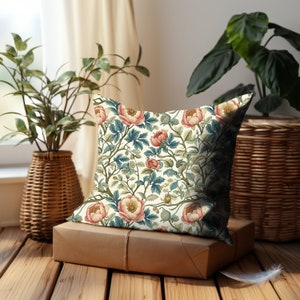 This lovely accent pillow features a repeating pattern of Art Nouveau peach roses with green and blue leaves on a white background in a lovely Victorian style botanical print. Reminiscent of William Morris.