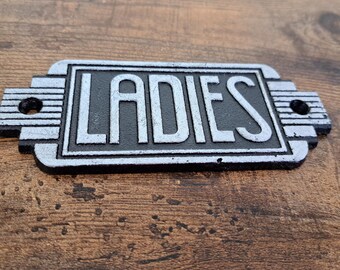 Cast metal 'LADIES' sign with mounting holes, Wall hanging