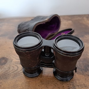 Antique leather cased opera glasses, Theatre field and marine binoculars, leather bound,  working binoculars