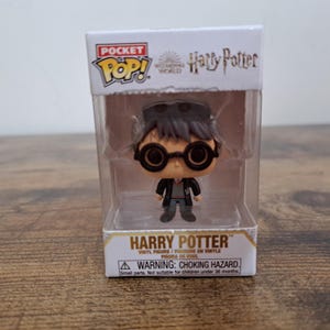 May include: A set of three ceramic mugs with a speckled, matte finish. The mugs are in shades of cream, light gray, and dark gray. Each mug has a simple, minimalist design, perfect for coffee or tea.