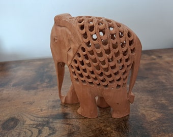 Vintage Carved Elephant, Hand carved elephant with small elephant inside, Wooden elephant ornament