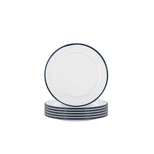 May include: A stack of eight white enamel dinner plates with a dark blue rim.