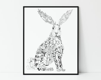 May include: Black and white art print of a sitting hare, filled with floral and leaf patterns. The hare has long ears and is set against a white background, framed in a black border. A decorative piece for home decor.