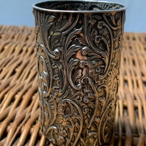 May include: A set of three ceramic mugs with a speckled, matte finish. The mugs are in shades of cream, light gray, and dark gray. Each mug has a simple, minimalist design and a rounded handle. Perfect for coffee or tea.