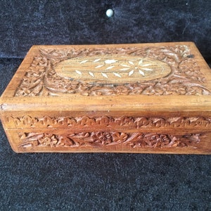 Vintage hand carved Hardwood box with carved leaves and flowers with inlaid Flower snd leaves