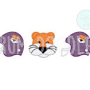 May include: Three purple and white gingham football helmets with orange and white tiger faces. The tiger faces have black noses and whiskers.