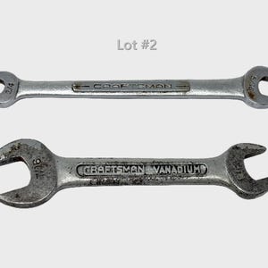 May include: Two silver-colored metal Craftsman wrenches labeled Lot #2. The top wrench features 1/4 and 5/16 inch open ends. The bottom wrench is marked Craftsman Vanadium and features 7/16 inch open ends on both sides of the tool head.