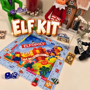 May include: An Elfopoly board game set featuring a colorful game board with gift box illustrations, blue dice, play money, and small holiday-themed game pieces. The text ELF KIT is displayed in large white letters above the game board.