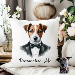 May include: White square throw pillow featuring a Jack Russell Terrier wearing a tuxedo and bow tie. The dog has brown and white fur and blue eyes. The words "Personalise Me" are written in black script across the bottom of the pillow.