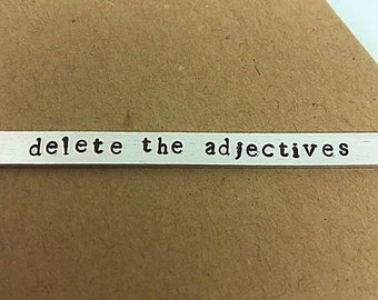 Delete the adjectives hand stamped aluminum, Harper Lee, To Kill a Mockingbird quote cuff bracelet