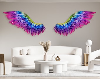 May include: Two large, colorful, iridescent wings with a rainbow gradient of pink, purple, blue, green, and yellow. The wings are mounted on a white wall above a white couch and a white coffee table.