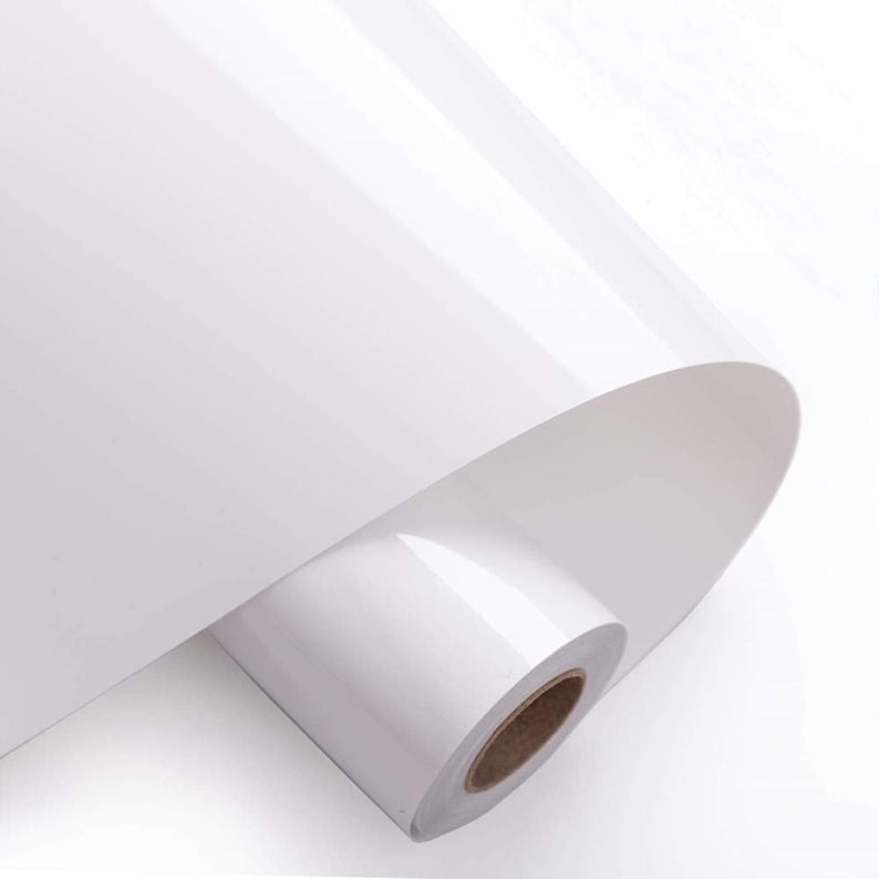 May include: A roll of white glossy paper, perfect for printing photos or documents. The paper is rolled up and ready to be used.