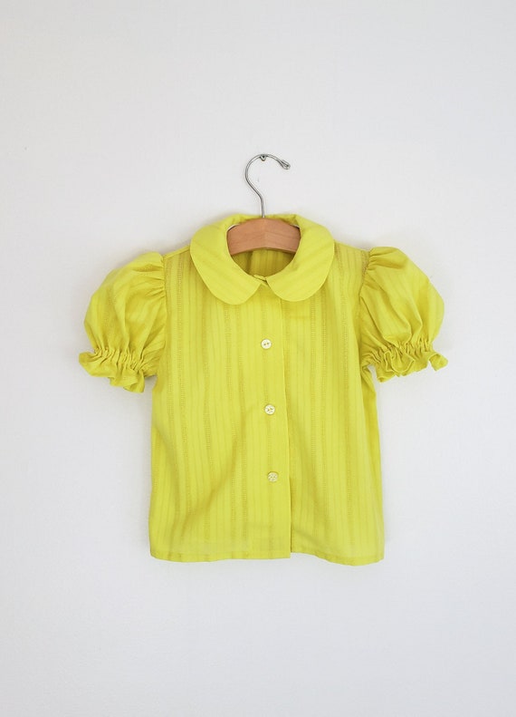 girls yellow blouse