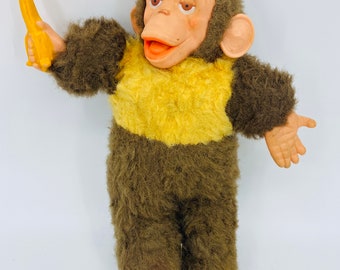 stuffed monkey with banana in hand
