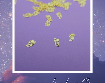 May include: A close-up of a purple surface with gold butterfly-shaped embellishments scattered across it. The image includes the text "LisaLunaCo".