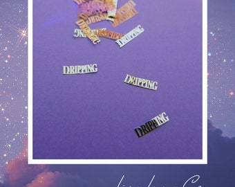 May include: A purple background with scattered gold and white paper cutouts that say "DRIPPING".