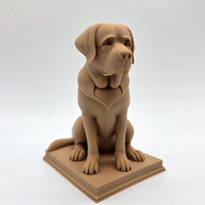 May include: A tan-colored Labrador Retriever statue, sitting upright on a square base. The dog has a detailed, realistic appearance, with its head tilted slightly. The statue is made of a solid material and is suitable for home decor.