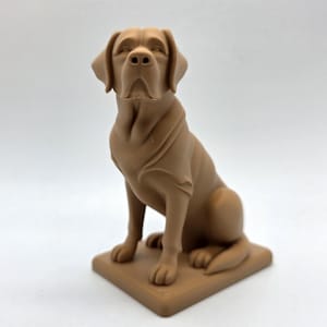 May include: A brown Labrador Retriever statue, sitting upright on a square base. The dog has a smooth coat and detailed facial features, including floppy ears and a gentle expression. The statue is a solid color and appears to be made of a durable material.