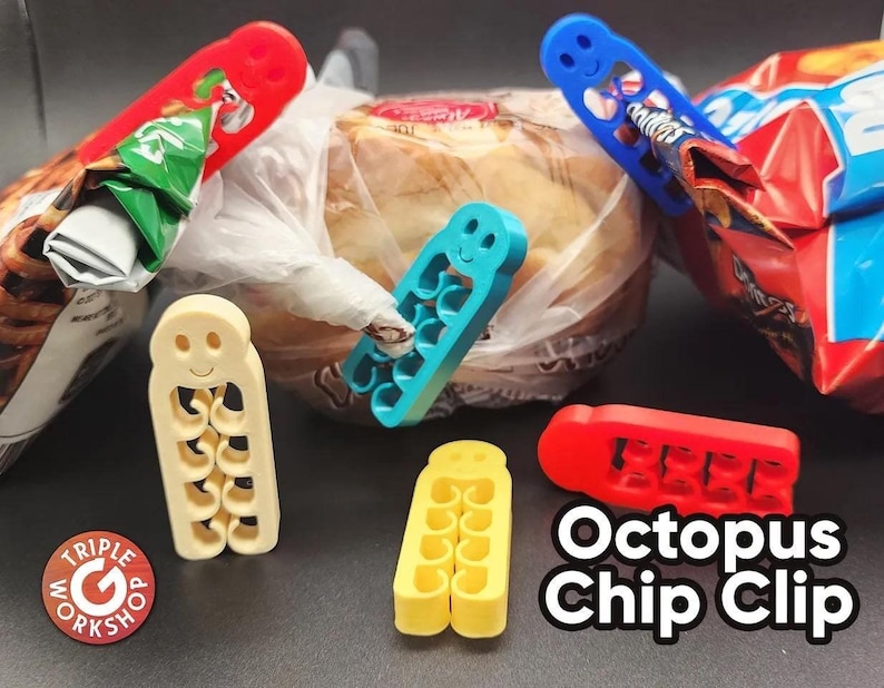May include: A collection of colorful plastic Octopus Chip Clips in red, blue, yellow, and cream. The clips are designed to seal bags of chips and other snacks. The image also shows a loaf of bread and bags of chips.