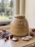 Beige dog urn, beige cat urn, golden retriever, labrador product logo